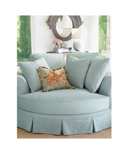 Oversize chair with pleated skirt and pillow